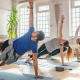 Stock image of six people doing pilates in a brightly lit studio