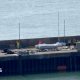 A Border Force boat with a dinghy.