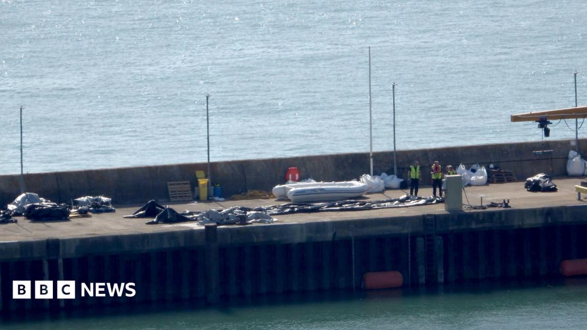 A Border Force boat with a dinghy.