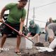 Captain Hook, Hawaii residents prepare stuff bags with sand in preparation of Tropical Storm Lala on Friday