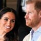 Prince Harry and Meghan sat next to each other and smiling in Colombia in 2024