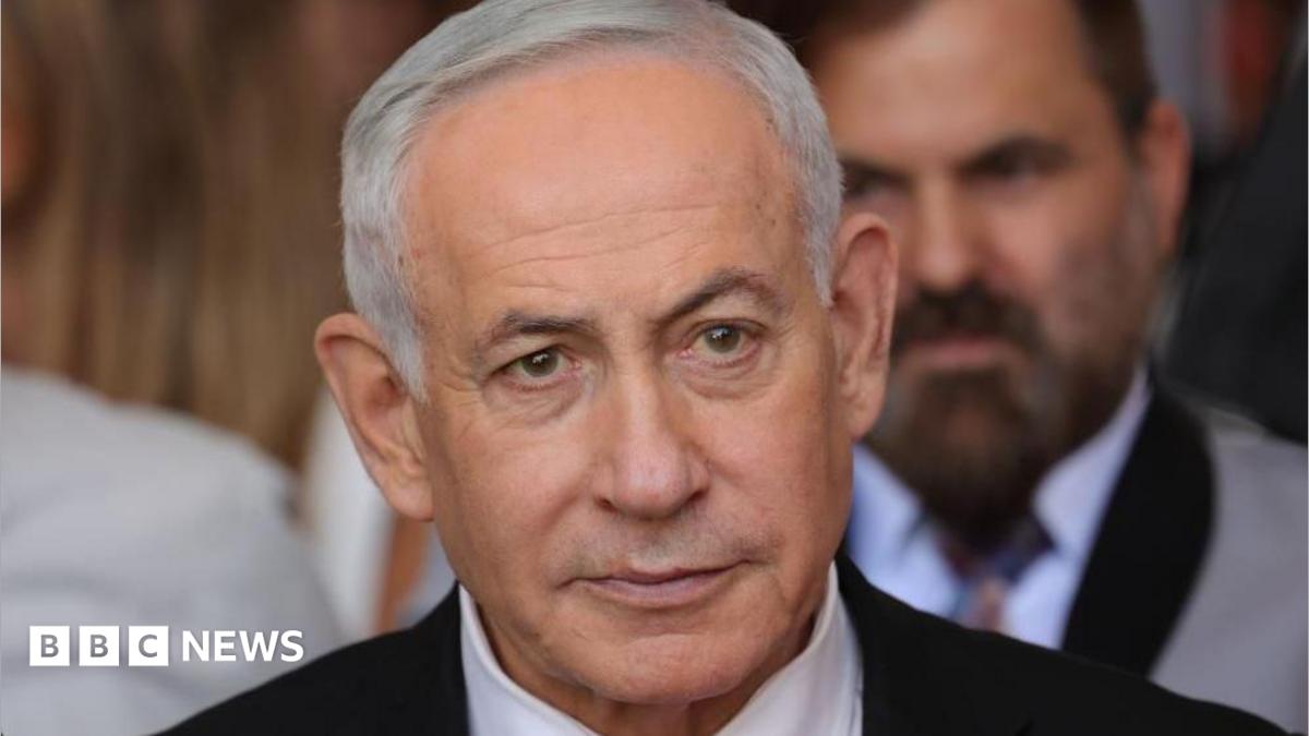 Close up of Benjamin Netanyahu from the shoulders up. He has short, grey hair and is wearing a shirt, tie and suit.