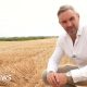 Tomos Morgan stood in a dry wheat field
