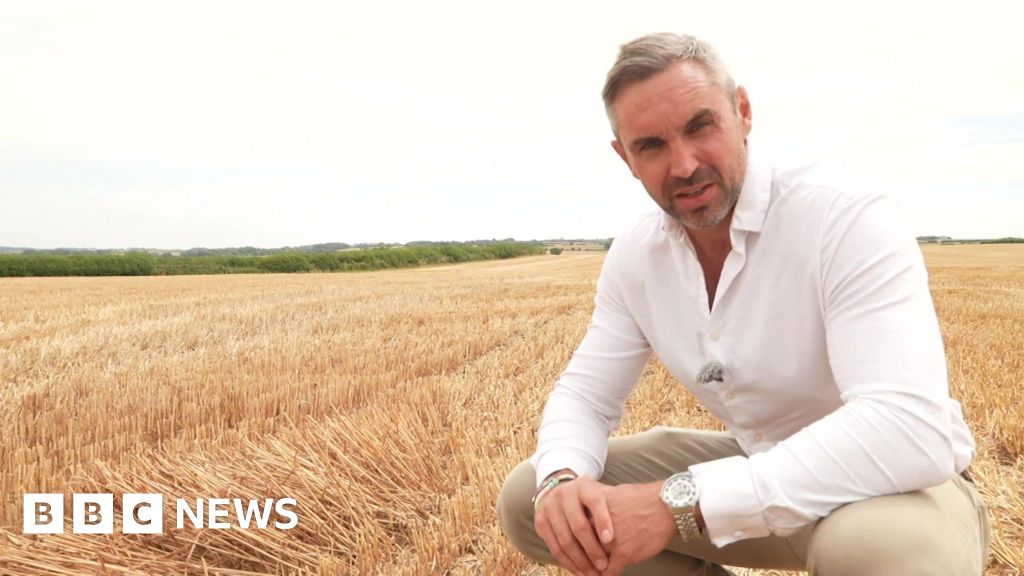 Tomos Morgan stood in a dry wheat field