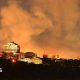 View of smoke rising from the site of damaged buildings in Kyiv.