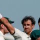 Australia cricketer Mitchell Starc celebrates his 10th wicket in the match by holding the ball up