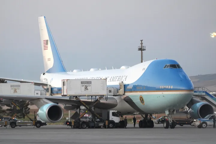 According to the reports, Trump boarded Air Force One via the stairs on the right side of the image, then hid inside a catering container on the opposite side of the plane, which took him to a different aircraft.