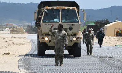 A U.S. Marine leads a military vehicle at a beach during a joint field training exercise conducted by the South Korea-US Combined Forces Command in Pohang on July 15, 2026.
