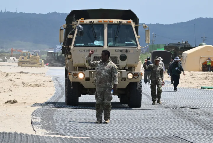 A U.S. Marine leads a military vehicle at a beach during a joint field training exercise conducted by the South Korea-US Combined Forces Command in Pohang on July 15, 2026.