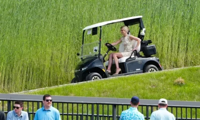 Natalie Harp pilots a golf cart at Trump’s New Jersey course.