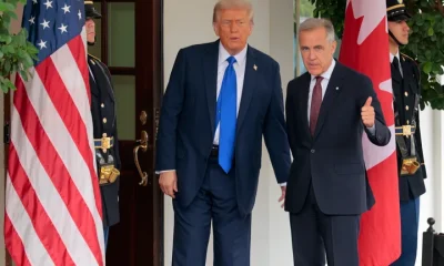 Canadian Prime Minister Mark Carney is greeted by Trump outside the West Wing of the White House on Oct. 7, 2025, in Washington, D.C.