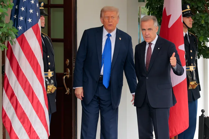 Canadian Prime Minister Mark Carney is greeted by Trump outside the West Wing of the White House on Oct. 7, 2025, in Washington, D.C.