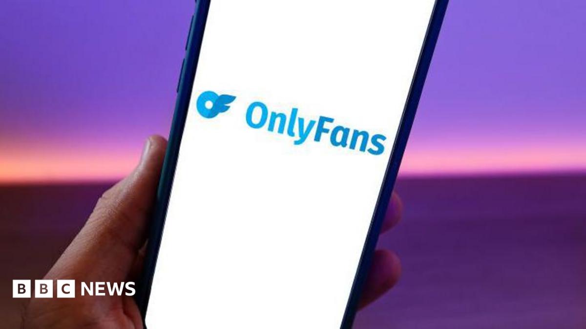A phone with the OnlyFans logo on the screen