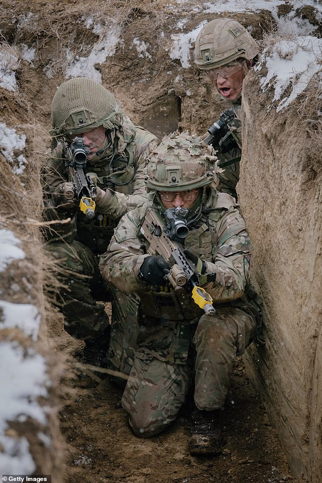 The British Army is rejecting more than 200 applicants every day. (File image of UK troops training in Romania)
