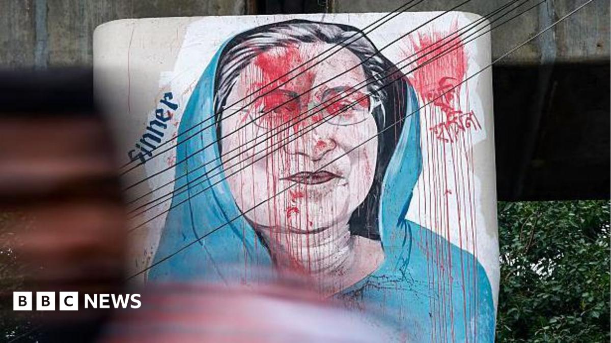 Vehicles move past graffiti depicting former Bangladeshi Prime Minister Sheikh Hasina in Dhaka