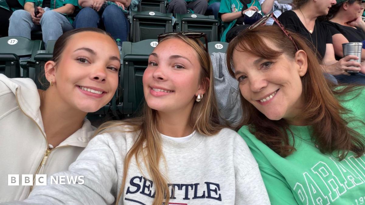 Julianna (left), Paige (centre) and mum Elizabeth Cardner at a baseball game