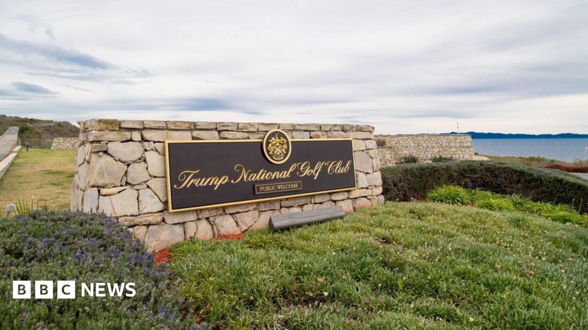 A sign for Trump's golf course overlooks a bluff in California