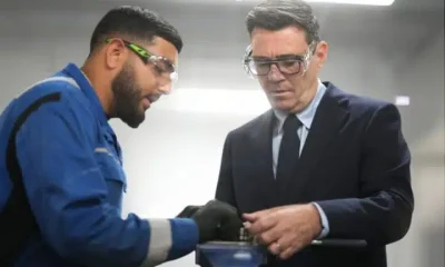 Prime Minister Andy Burnham meets apprentices as he visits Submarine Academy for Skills and Knowledge (SASK) at BAE Systems, on July 30, 2026 in Barrow in Furness, United Kingdom. Both he and the apprentice are in workshop goggles.