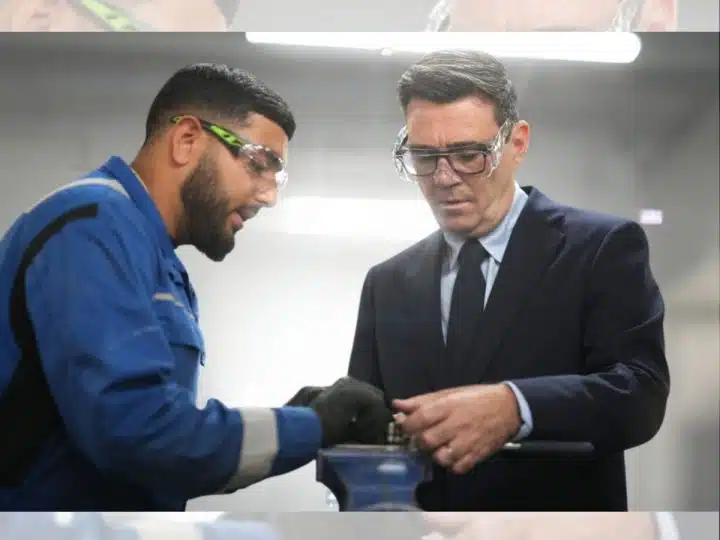 Prime Minister Andy Burnham meets apprentices as he visits Submarine Academy for Skills and Knowledge (SASK) at BAE Systems, on July 30, 2026 in Barrow in Furness, United Kingdom. Both he and the apprentice are in workshop goggles.