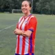 Faten Ben Omar El Azizi smiles on the football pitch in her kit, with her arms crossed. Others died too trying to swim to Ceuta.