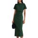 A woman wearing a dark green midi dress, carrying a black handbag