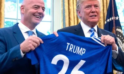 FIFA president Gianni Infantino and Donald Trump holding a football shirt saying Trump 26 to promote the 2026 World Cup
