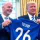 FIFA president Gianni Infantino and Donald Trump holding a football shirt saying Trump 26 to promote the 2026 World Cup