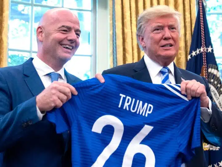 FIFA president Gianni Infantino and Donald Trump holding a football shirt saying Trump 26 to promote the 2026 World Cup
