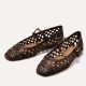 A pair of brown woven leather flats
