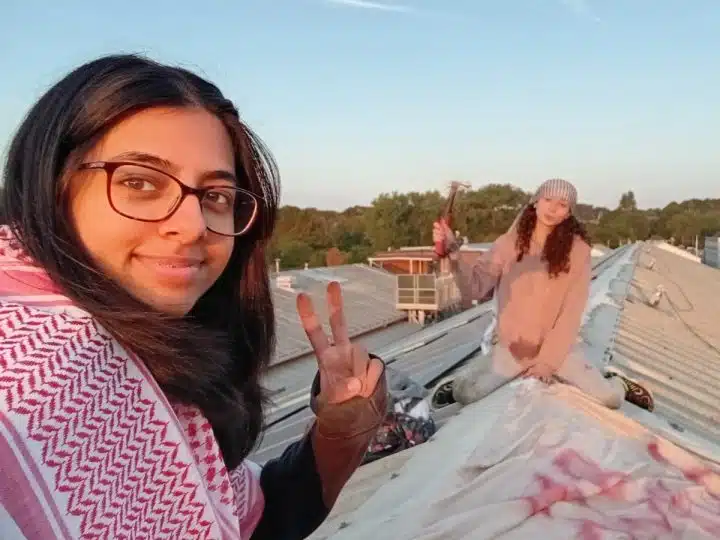 Activists on the roof of the Martin-Baker factory in Uxbridge.