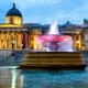 Outside the National Gallery in London in the evening when it's illuminated with lights and so is the large water fountain outside. Workers are experiencing racially divided break facilities at the historic institution