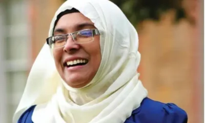 Noor Jahan Begun, who recently left Your Party, smiles, her cream hijab contrasting her blue top