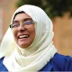 Noor Jahan Begun, who recently left Your Party, smiles, her cream hijab contrasting her blue top