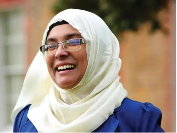 Noor Jahan Begun, who recently left Your Party, smiles, her cream hijab contrasting her blue top