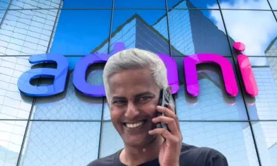 Composite image showing headshot of Ravi Nair in front of facade of Adani office building