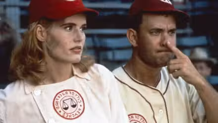Geena Davis and Tom Hanks with his finger on his nose in A League of Their Own