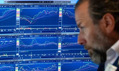 Wall St dips as investors monitor Iran talks, earnings