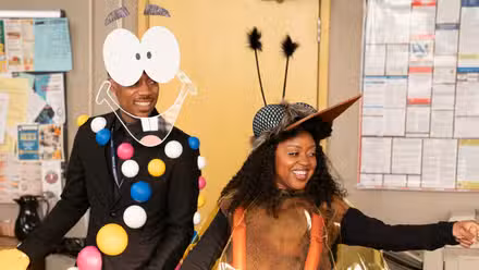 Tyler James Williams and Quinta Brunson dressed as Mr. DNA and the mosquito in amber from Jurassic Park