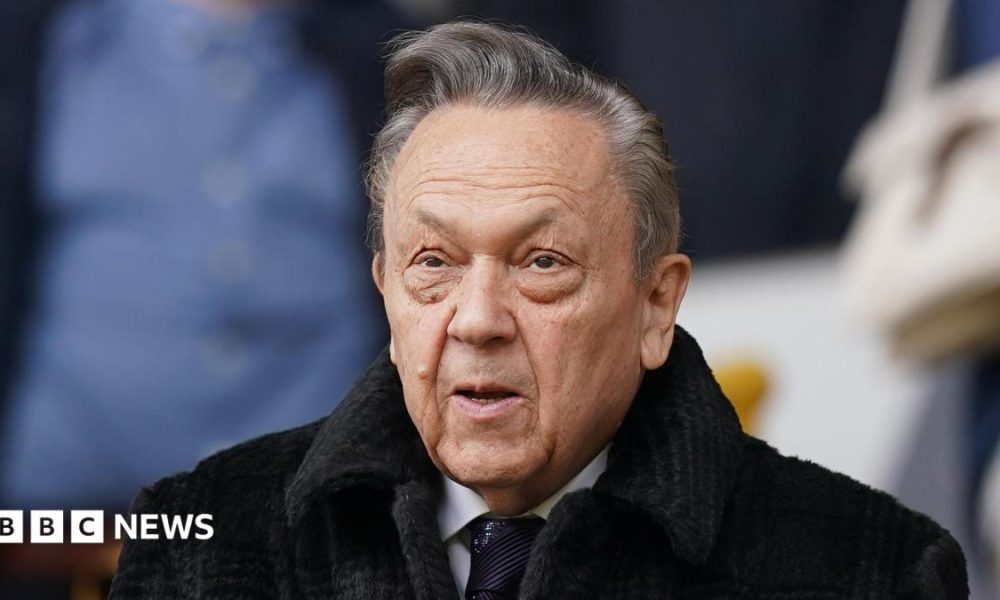 David Sullivan, wearing a dark coat and tie, shown down to his shoulders.