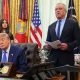 Donald Trump speaks from a lectern during a news conference at the White House. He is accompanied by Robert F Kennedy Jr.