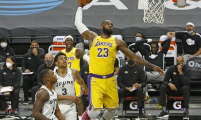 Ageless: Los Angeles superstar LeBron James soars for a dunk in the Lakers' 121-107 NBA victory over the San Antonio Spurs on his 36th birthday
