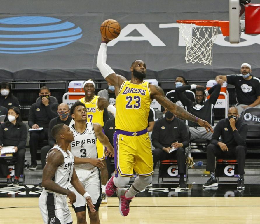 Ageless: Los Angeles superstar LeBron James soars for a dunk in the Lakers' 121-107 NBA victory over the San Antonio Spurs on his 36th birthday