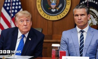 US President Donald Trump and Secretary of Defense Pete Hegseth listen to questions from the press during a Cabinet meeting.