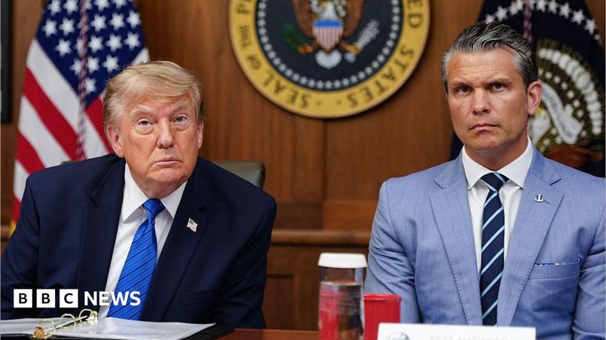 US President Donald Trump and Secretary of Defense Pete Hegseth listen to questions from the press during a Cabinet meeting.