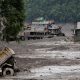 Mud covers houses and a road following a flash flood at Trishuli in Nuwakot district, Nepal, August 26, 2026.