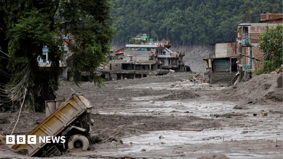 Mud covers houses and a road following a flash flood at Trishuli in Nuwakot district, Nepal, August 26, 2026.
