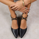 black flats with crisscross straps at the ankle
