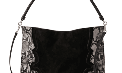 black bag featuring curved, Western-inspired panel details snake-embossed leather