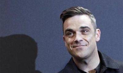 British singer Robbie Williams arrives on the red carpet for the German premiere of ''Cars 2'' in Munich July 28, 2011.