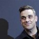 British singer Robbie Williams arrives on the red carpet for the German premiere of ''Cars 2'' in Munich July 28, 2011.